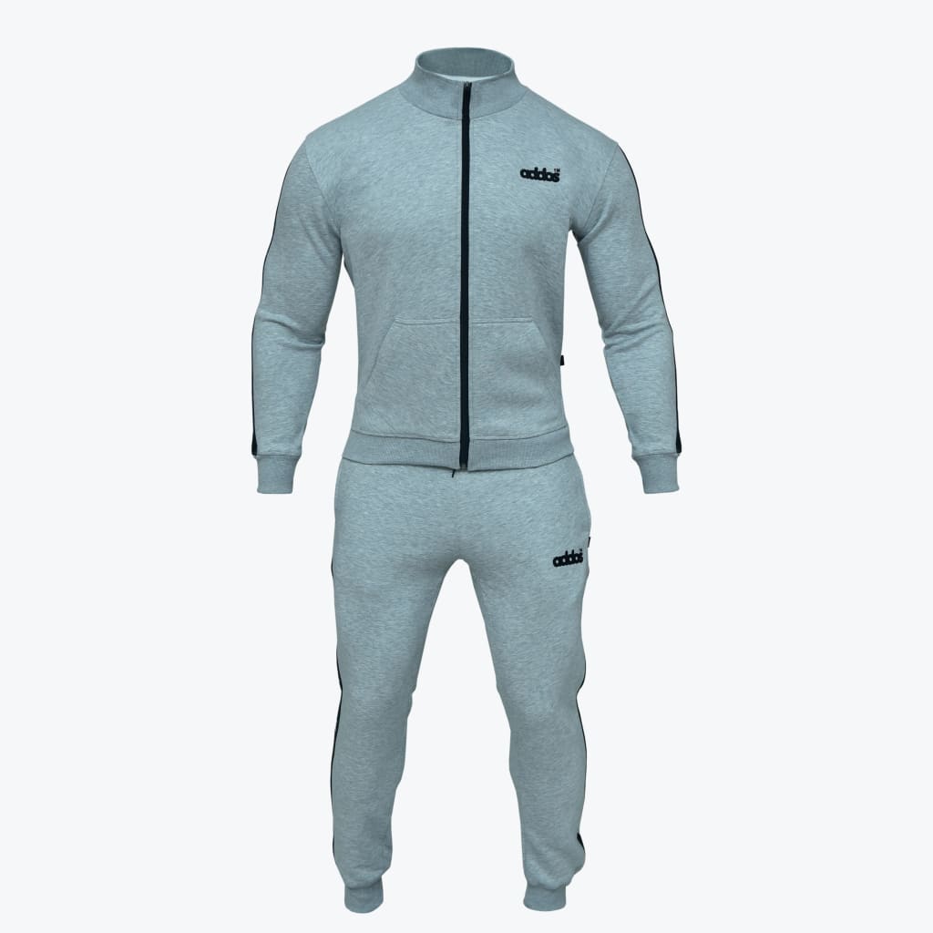 A light grey men tracksuit set including a full-zip jacket and matching jogger pants with black side stripes, shown on a white background.