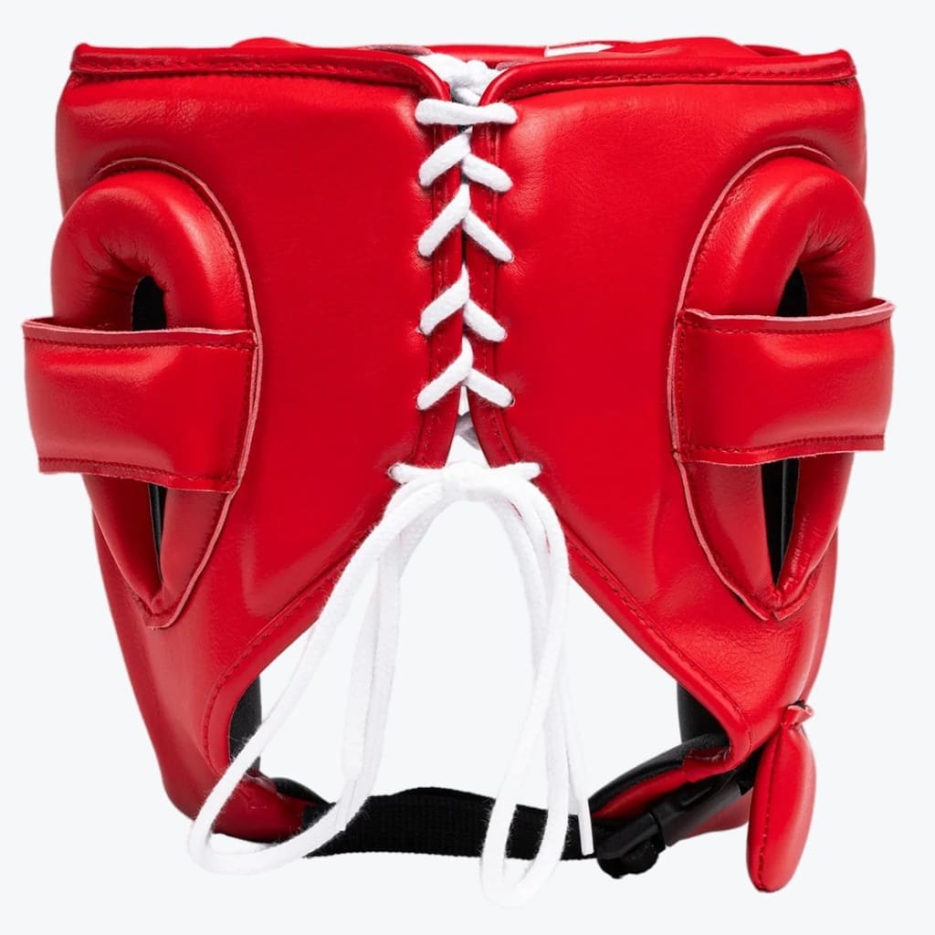 Rear view of a red leather boxing headgear with white laces and padded ear guards against a white background.