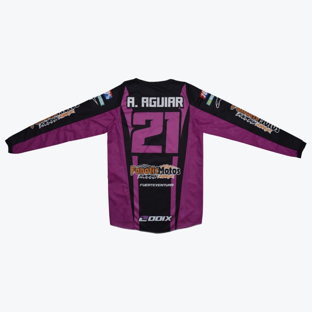 Back view of a purple and black long-sleeved motocross jersey with A. AGUIAR and the number 21 printed on the back, along with sponsor logos like FanaticMotos.