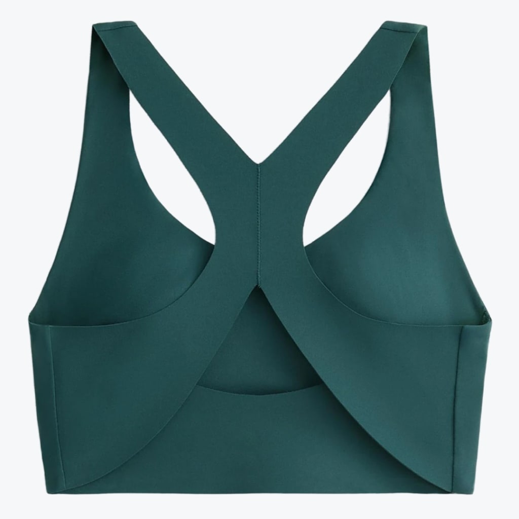 Back view of a dark green sports bra with a wide criss-cross strap design on a white background.