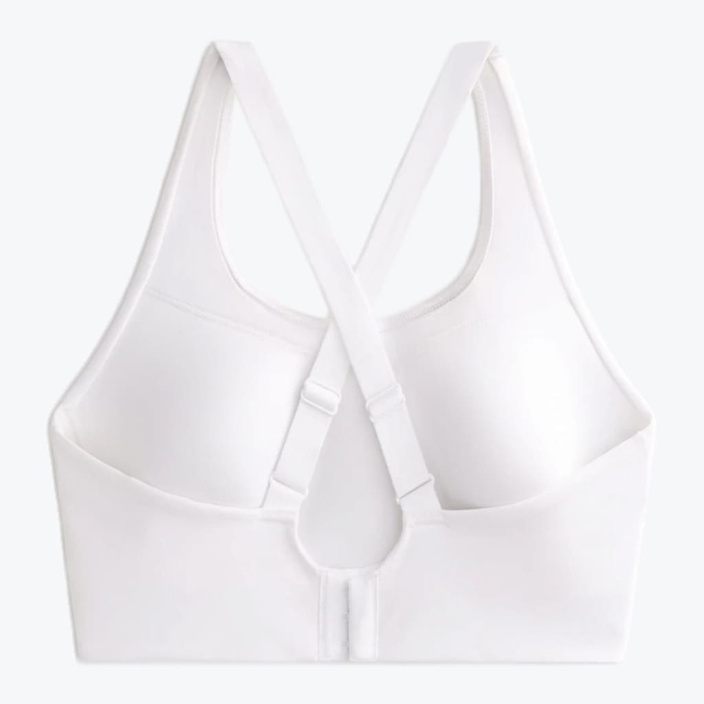 Back view of a white sports bra with adjustable cross-back straps and a hook-and-eye closure on a white background.