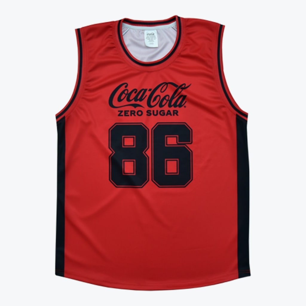 A red basketball jersey with Coca-Cola Zero Sugar and the number 86 printed in black on the front.