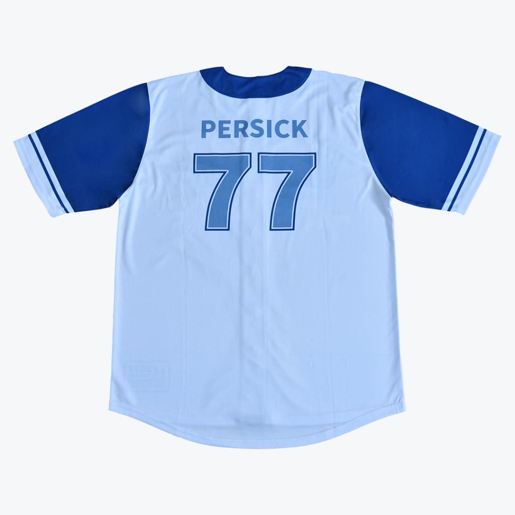 The back of a light blue baseball jersey with dark blue sleeves, featuring the name PERSICK and the number 77 printed in blue on the back.