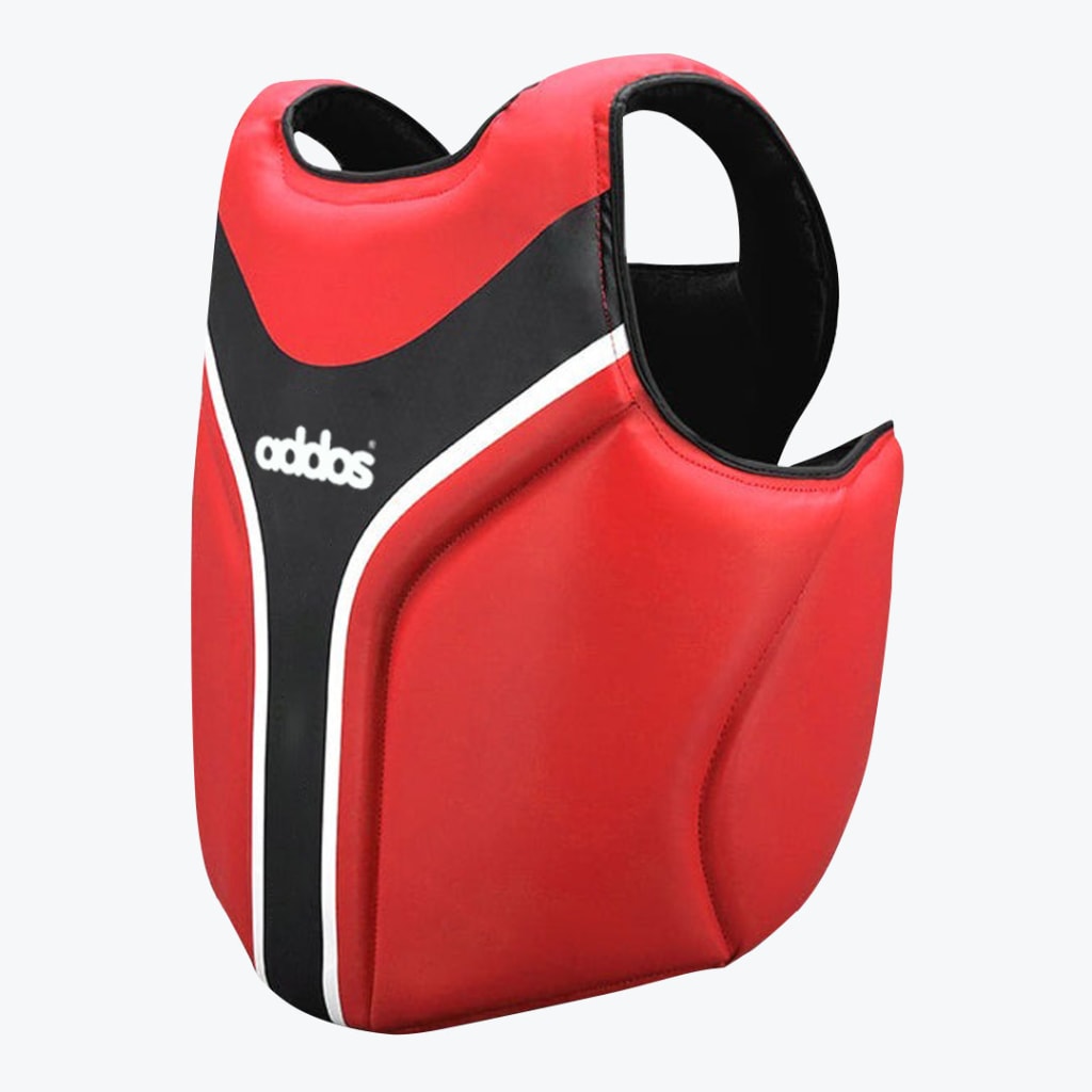 A red martial arts chest guard with black and white accents and the word addos printed on the front.
