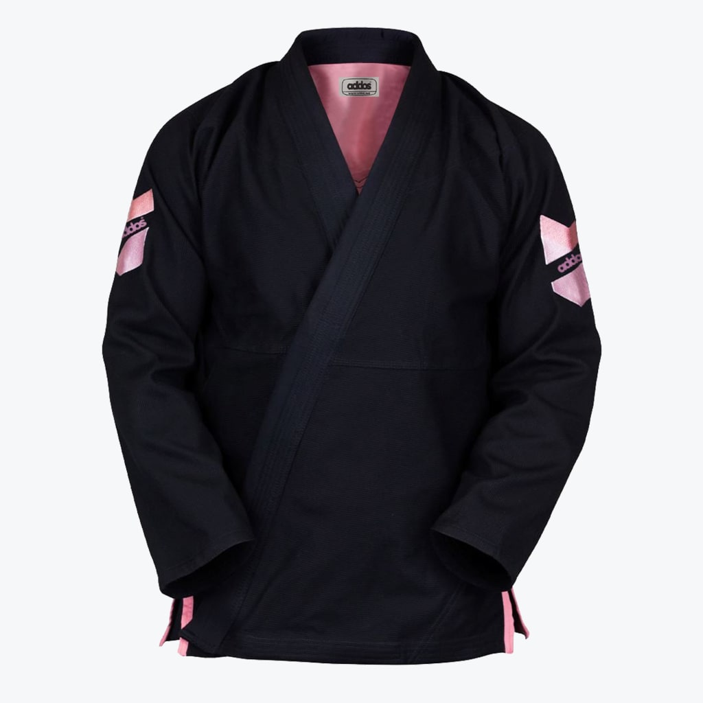 Front view of a black Addos Brazilian Jiu-Jitsu gi jacket with pink accents on the sleeves, inner collar, and side slits, set against a white background.