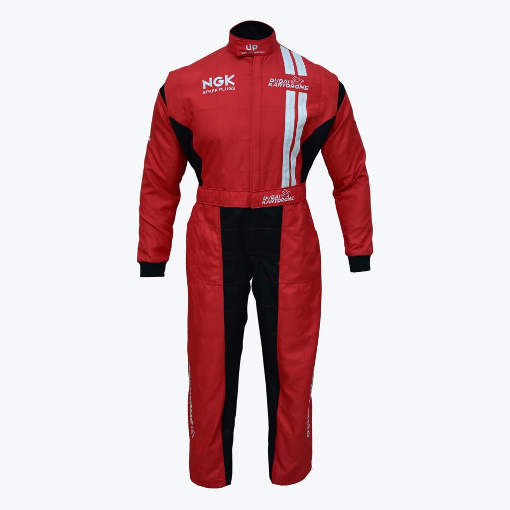 A red and black karting suit with Dubai Kartdrome and NGK Spark Plugs logos on a white background.