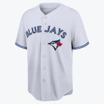 A light grey Toronto Blue Jays baseball jersey with BLUE JAYS written in blue across the chest and the teams blue jay logo on the left.