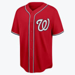 A red Washington Nationals baseball jersey with a white curly W logo on the left chest and navy and white trim.