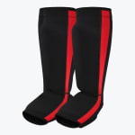 A pair of black slip-on shin and instep guards with a red stripe on the side, displayed against a white background.