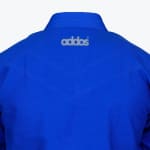 Close-up of the back of a blue Addos judo gi jacket, showing the embroidered logo and reinforced stitching.