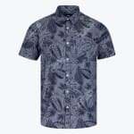 A mens short sleeve button down shirt in slate blue with a dark navy tropical leaf pattern featuring white buttons and a chest pocket