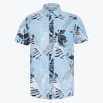 A light blue short-sleeve button-down shirt with a white and dark blue tropical palm leaf print on a plain white background.