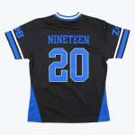 Back of a black athletic jersey with NINETEEN and in blue, featuring blue and white trim and Greek letters on the sleeves.