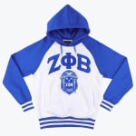 A royal blue and white raglan hoodie with the Greek letters ZΦB and the Zeta Phi Beta shield embroidered on the front.