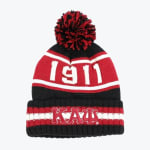 A black, red, and white knit pom-pom beanie with knitted on the crown and the Greek letters for Kappa Alpha Psi embroidered on the cuffed brim.