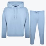 A light blue matching tracksuit set consisting of a pullover hoodie with a kangaroo pocket and matching sweatpants with a drawstring waist, displayed against a plain white background.