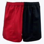 A pair of split-color athletic shorts, with the left leg in red and the right leg in black, featuring an elastic waistband against a white background.