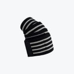 A rolled-up black elastic joint wrap with white stripes and a velcro strap on a solid white background.