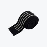 A rolled-up black elastic knee wrap with four parallel grey stripes on a white background.
