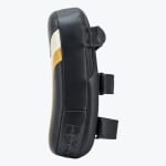 Side profile of a black leather Muay Thai kick pad with a curved design, a top handle, and two forearm straps on a white background.