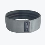 A circular gray fabric hip resistance band with a black label reading Medium Hip Resistance Band on a white background.