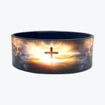 A custom leather weightlifting belt featuring a printed graphic of a Christian cross silhouetted against a bright sunrise.