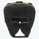 Front view of a black leather boxing headgear with gold accents and cheek protectors on a white background.