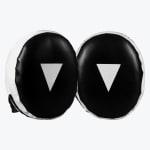 A pair of black and white oval-shaped boxing focus mitts with white inverted triangle targets in the center, set against a plain white background.