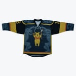 A custom hockey jersey laid flat on a white background, featuring Winnie the Pooh holding a hockey stick and a syrup bottle, flanked by two stone gargoyles on a dark blue and gold design.