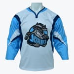 A light blue and white hockey jersey with a cartoon jackalope logo on the front, displayed on a mannequin.