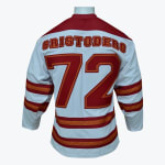 The back of a white hockey jersey with the name CRISTODERO and the number 72 in red with orange outlines, featuring red and orange stripes on the sleeves and hem.