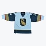 A light blue, navy, and gold hockey jersey with a central crest depicting Gary the Snail wearing a golden knight helmet.