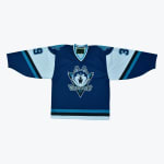 A navy blue hockey jersey with white shoulders, teal stripes, and a central wolf logo with the word NORDIQUES on a white background.