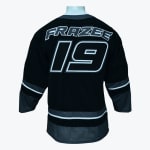 Back view of a black hockey jersey with FRAZEE and 19 in white and grey outlined lettering on a white mannequin.