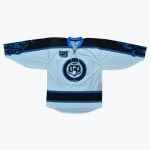 A light blue hockey jersey with black and blue nautical designs, featuring a lighthouse logo in the center, the number 49 on the chest, and kraken tentacles on the sleeves.