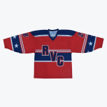 A flat lay of a red hockey jersey with RVC on the chest, featuring blue sleeves with white stars and numbers on the shoulders.