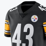 A close-up of a black Pittsburgh Steelers jersey with the number 43 and the team logo on the chest.