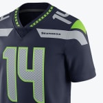 Close-up of a navy blue Seattle Seahawks NFL jersey with the number 14 in grey and lime green.