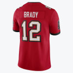 The back of a red Tom Brady Tampa Bay Buccaneers jersey with the name BRADY and number 12.