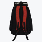 Back view of a black backpack with padded red shoulder straps and adjustable black straps on a white background.