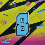 A retro-themed graphic of the number 8 in light blue with a black and white border, set against a yellow and pink gradient background with black diagonal stripes and 80s-style geometric patterns.