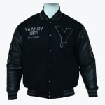 A black varsity jacket with leather sleeves, featuring a dripping Y patch and YAAKOV embroidery on a white mannequin.