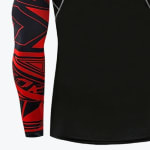 Close-up of a black compression shirt with a red and black patterned sleeve.