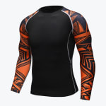 A tight-fitting black long-sleeve athletic compression shirt with vibrant orange and black patterned sleeves displayed against a plain white background.