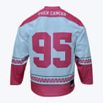 The back of a white hockey jersey with pink shoulders, sleeves, and hem. It features the text PUCK CANCER in white on the upper back and the number 95 in large pink font in the center.