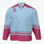 A white hockey jersey with pink accents, featuring a breast cancer awareness pink ribbon on the chest and a geometric pink pattern band near the hem.