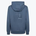Back view of a blue hoodie with a rectangular line-art graphic of a lighthouse on a rocky cliff above ocean waves.