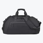 A front-facing studio shot of a matte black travel duffel bag with multiple zippered compartments, top handles, and an adjustable shoulder strap against a plain white background.