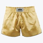 A pair of shiny gold satin boxing shorts with an elastic waistband and a grey Addos logo patch in the center, set against a plain white background.
