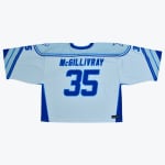 Back view of a light blue sports jersey with McGILLIVRAY and the number 35 printed in blue.